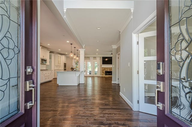 875 Soaring Cir, Marietta, GA 30062 - entrance foyer with crown molding, dark wood finished floors, recessed lighting, and a fireplace with raised hearth