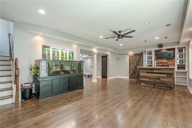 875 Soaring Cir, Marietta, GA 30062 - living room featuring a barn door, a ceiling fan, stairway, recessed lighting, and wood finished floors