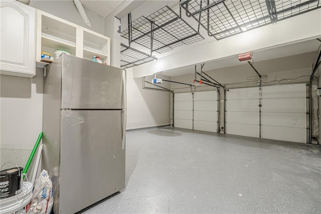 875 Soaring Cir, Marietta, GA 30062 - garage with freestanding refrigerator and a garage door opener
