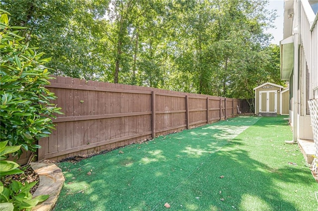875 Soaring Cir, Marietta, GA 30062 - fenced backyard featuring a storage unit