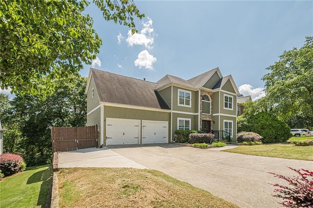875 Soaring Cir, Marietta, GA 30062 - view of front of house featuring an attached garage, concrete driveway, and a shingled roof