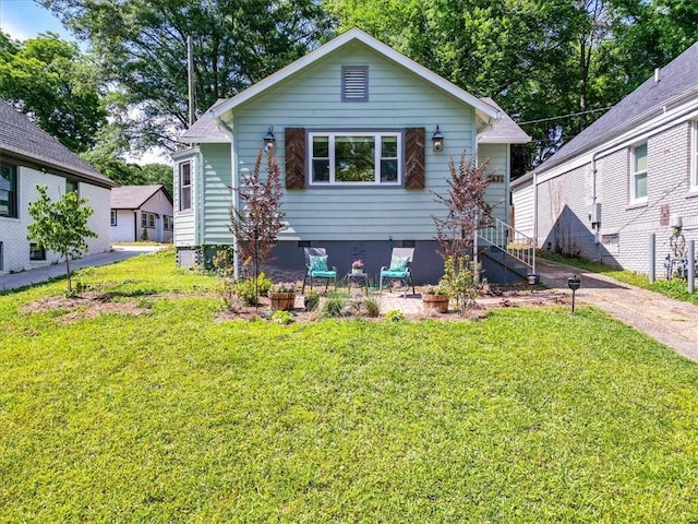 bungalow-style house with a front yard