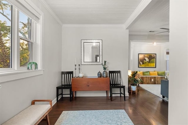 sitting room featuring ornamental molding, ceiling fan, and dark wood-type flooring