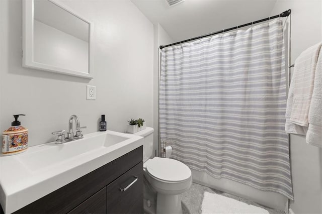 bathroom with vanity, toilet, and curtained shower