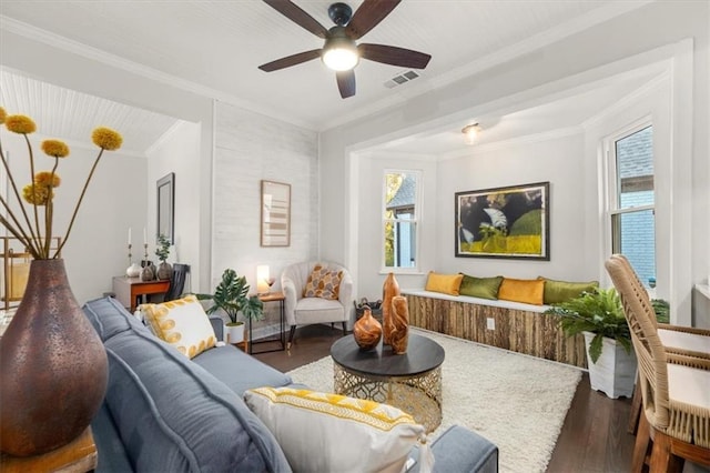 living room featuring ceiling fan, dark hardwood / wood-style flooring, and crown molding