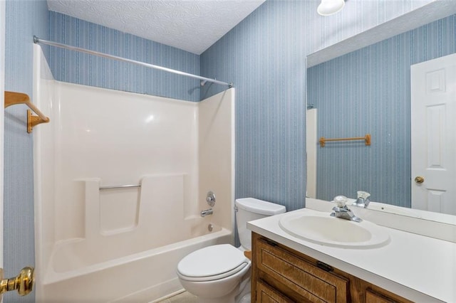 48 Saddle Field Cir NW, Cartersville, GA 30121 - bathroom with toilet,  shower combination, vanity, wallpapered walls, and a textured ceiling