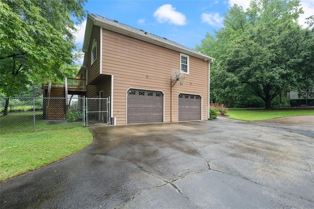48 Saddle Field Cir NW, Cartersville, GA 30121 - view of property exterior featuring driveway, a garage, and a gate