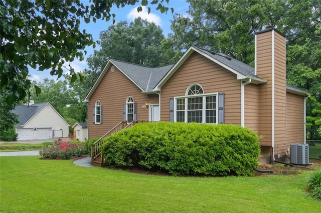 48 Saddle Field Cir NW, Cartersville, GA 30121 - view of front of home featuring central AC, a chimney, a front yard, and a garage