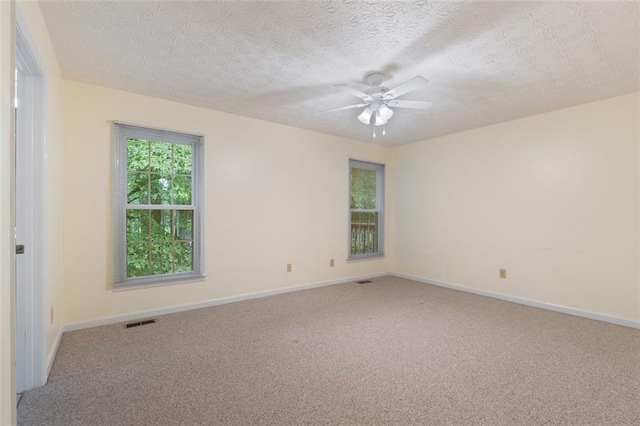 48 Saddle Field Cir NW, Cartersville, GA 30121 - carpeted spare room with ceiling fan, baseboards, and a textured ceiling