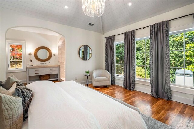 bathroom with hardwood / wood-style flooring, vanity, and plenty of natural light