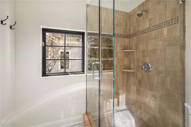 bathroom featuring a shower stall