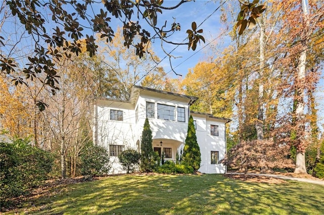 view of front of house featuring a front yard and stucco siding