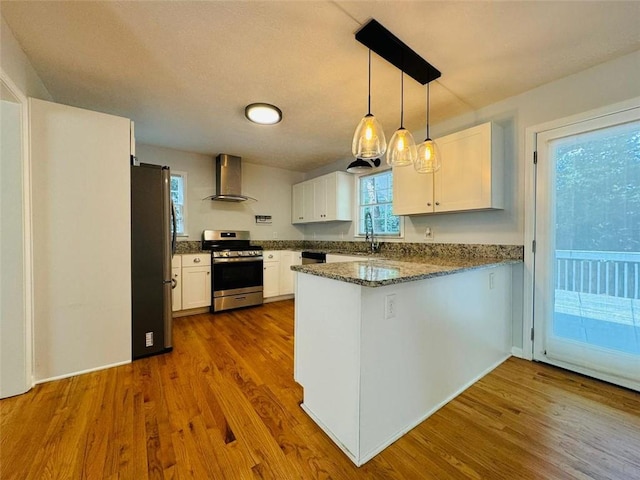 3210 Ebenezer Rd, Marietta, GA 30066 - kitchen with appliances with stainless steel finishes, wall chimney exhaust hood, a peninsula, a sink, and white cabinetry