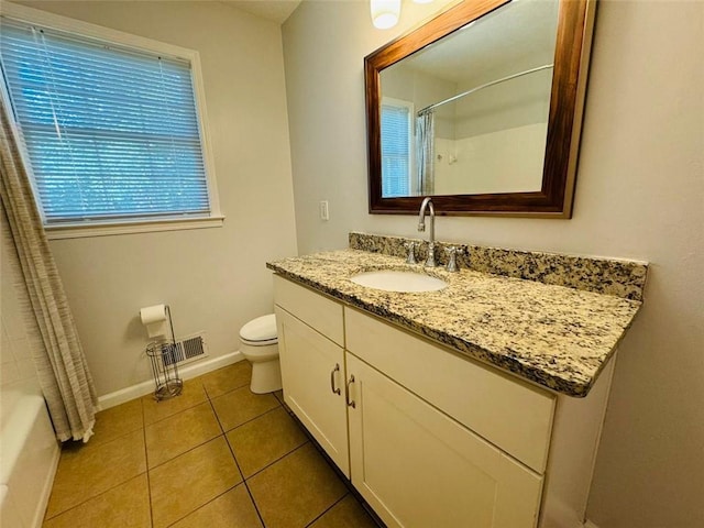 3210 Ebenezer Rd, Marietta, GA 30066 - bathroom with vanity, toilet, tile patterned flooring, baseboards, and shower / bath combo