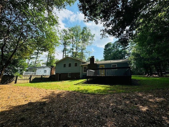 3210 Ebenezer Rd, Marietta, GA 30066 - back of house featuring a deck and a chimney