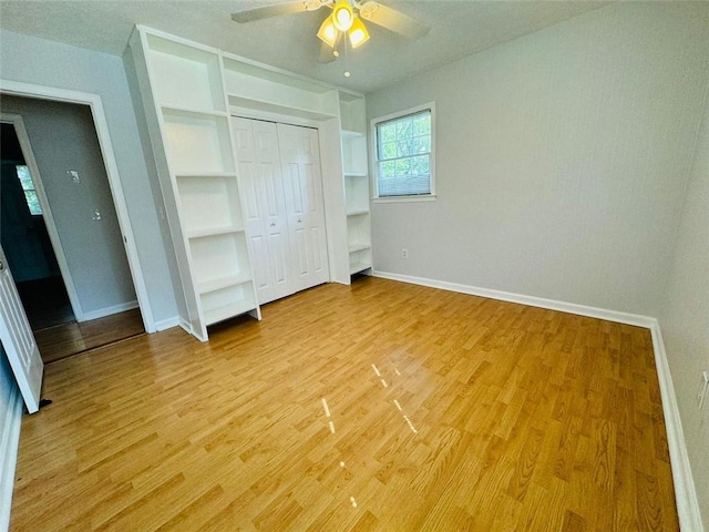 3210 Ebenezer Rd, Marietta, GA 30066 - unfurnished bedroom with baseboards, light wood finished floors, and ceiling fan