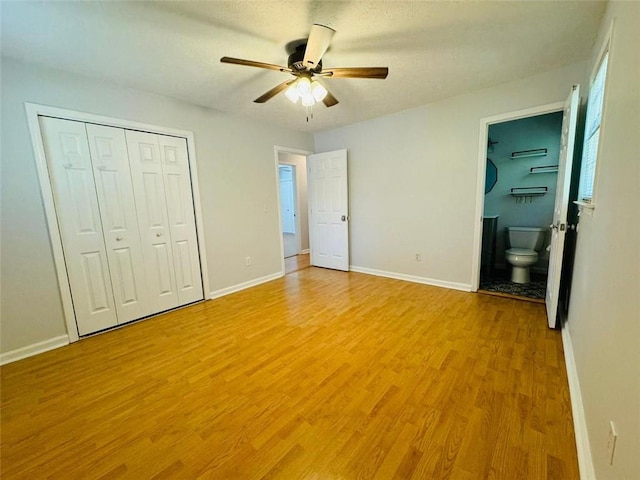 3210 Ebenezer Rd, Marietta, GA 30066 - unfurnished bedroom with light wood-type flooring, baseboards, a closet, ensuite bath, and ceiling fan