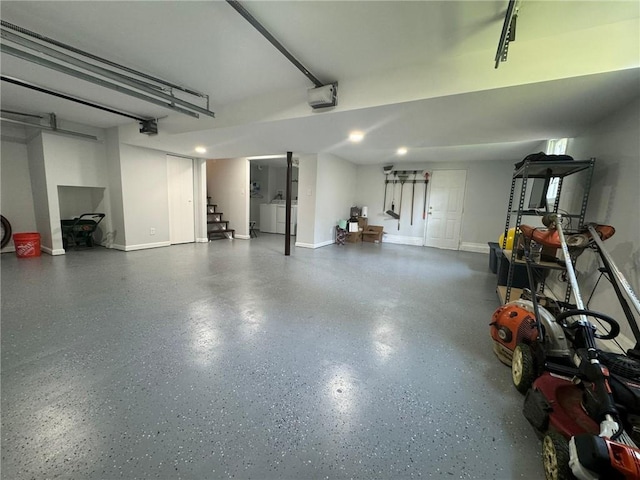 3210 Ebenezer Rd, Marietta, GA 30066 - garage with a garage door opener and baseboards