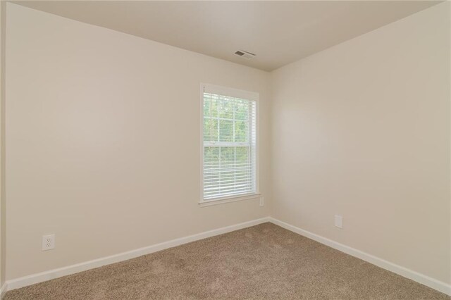 unfurnished room featuring carpet flooring