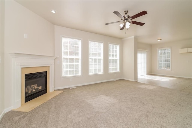 unfurnished living room featuring light carpet and plenty of natural light