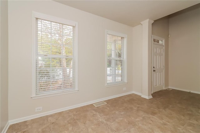 unfurnished room with plenty of natural light