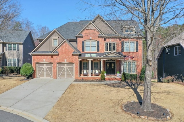 view of front of property featuring a garage and covered porch