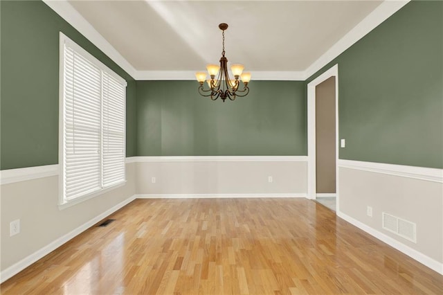 4963 Kingsbridge Ct, Powder Springs, GA 30127 - spare room with a chandelier, wood finished floors, baseboards, and ornamental molding