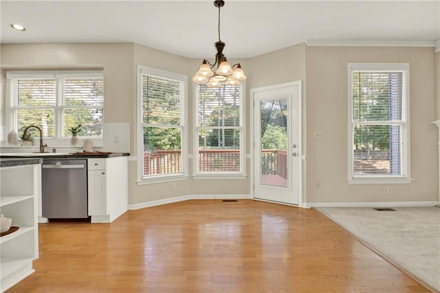 4963 Kingsbridge Ct, Powder Springs, GA 30127 - unfurnished dining area with a chandelier, plenty of natural light, light wood finished floors, recessed lighting, and crown molding