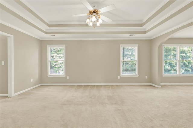 4963 Kingsbridge Ct, Powder Springs, GA 30127 - spare room featuring a tray ceiling, light colored carpet, crown molding, a ceiling fan, and baseboards