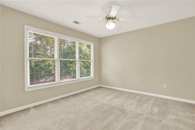 4963 Kingsbridge Ct, Powder Springs, GA 30127 - spare room with light colored carpet, baseboards, and ceiling fan