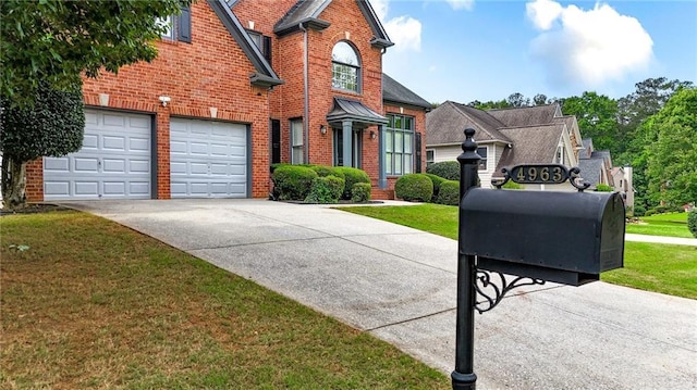 4963 Kingsbridge Ct, Powder Springs, GA 30127 - traditional home featuring brick siding, driveway, and a front yard