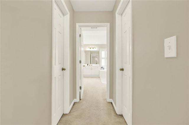 4963 Kingsbridge Ct, Powder Springs, GA 30127 - hallway with light carpet and baseboards