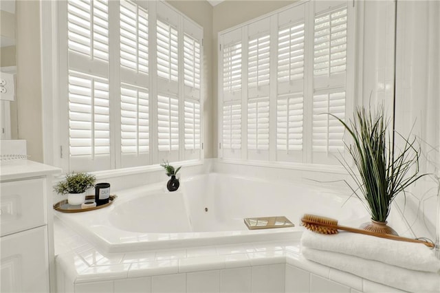 4963 Kingsbridge Ct, Powder Springs, GA 30127 - bathroom featuring a whirlpool tub and vanity