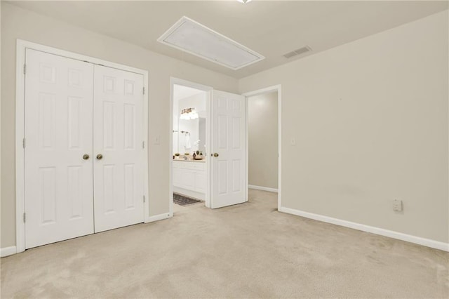 4963 Kingsbridge Ct, Powder Springs, GA 30127 - unfurnished bedroom with attic access, light colored carpet, baseboards, and a closet