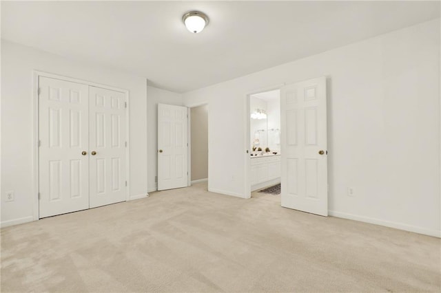 4963 Kingsbridge Ct, Powder Springs, GA 30127 - unfurnished bedroom with light colored carpet, baseboards, a closet, and connected bathroom