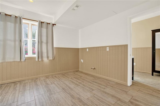 4963 Kingsbridge Ct, Powder Springs, GA 30127 - unfurnished room featuring wood finished floors and a wainscoted wall