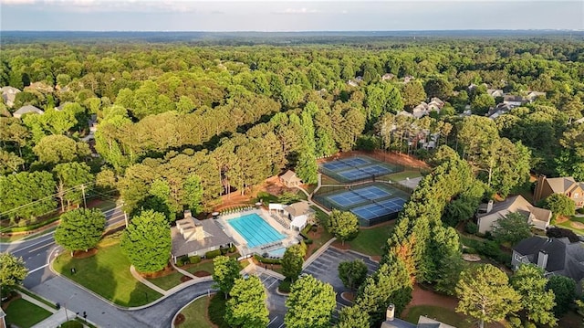 4963 Kingsbridge Ct, Powder Springs, GA 30127 - aerial view of property and surrounding area featuring a forest and a pool