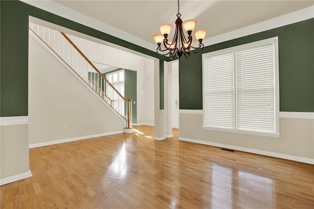 4963 Kingsbridge Ct, Powder Springs, GA 30127 - unfurnished room featuring a chandelier, stairway, healthy amount of natural light, and light wood-type flooring