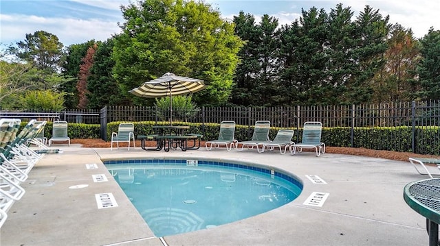 4963 Kingsbridge Ct, Powder Springs, GA 30127 - community pool with a patio area and view of scattered trees