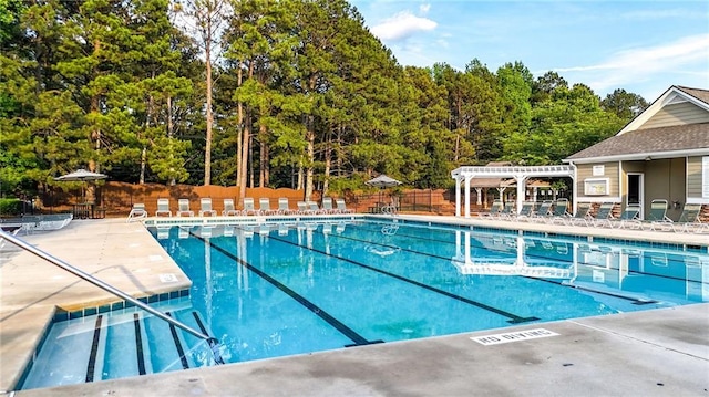 4963 Kingsbridge Ct, Powder Springs, GA 30127 - community pool featuring a pergola and a patio area