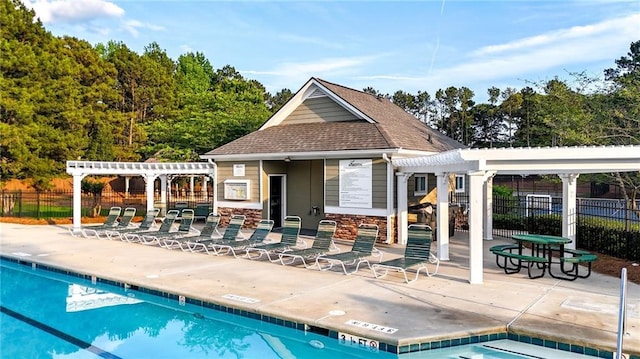 4963 Kingsbridge Ct, Powder Springs, GA 30127 - community pool with a pergola, a patio area, and an outbuilding
