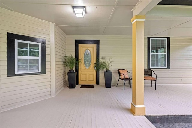 property entrance featuring covered porch