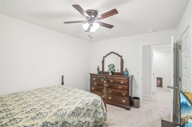 bedroom featuring light carpet and ceiling fan