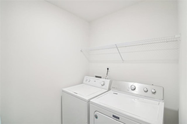 laundry room with laundry area and washing machine and dryer