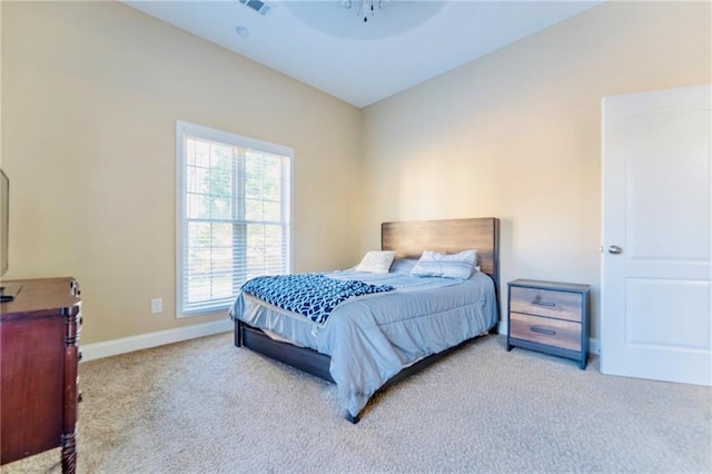 bedroom with carpet floors, visible vents, ceiling fan, and baseboards