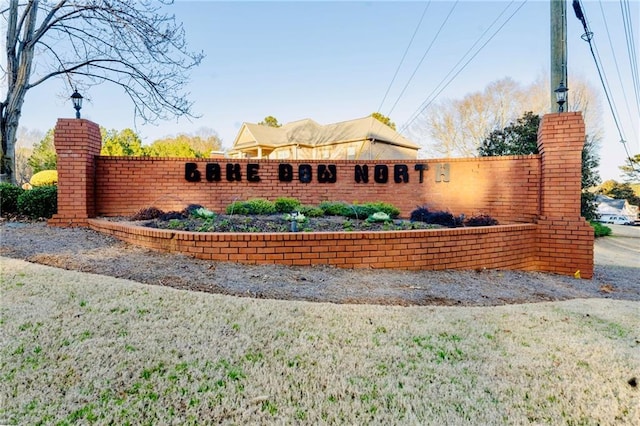 community sign featuring fence