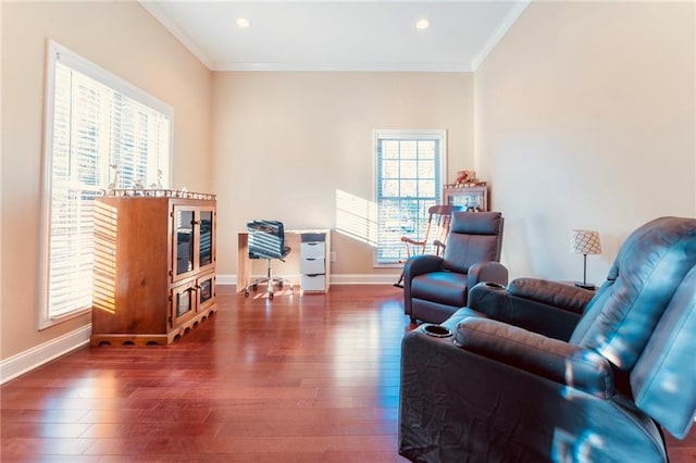 living area with baseboards, ornamental molding, wood finished floors, and recessed lighting