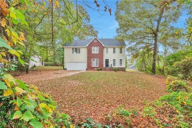 colonial inspired home featuring a garage