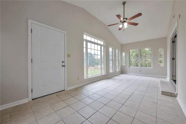 interior space featuring ceiling fan, a healthy amount of sunlight, and vaulted ceiling