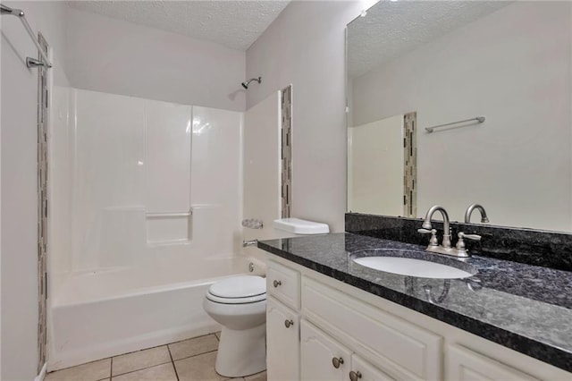 full bathroom featuring tile patterned floors, vanity, a textured ceiling, shower / bathing tub combination, and toilet